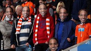 Blackpool fans wear Paul Ince masks