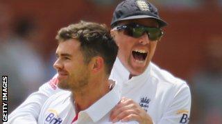 James Anderson is congratulated by Graeme Swann