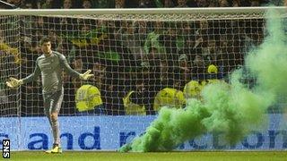 A flare lands close to Fraser Forster