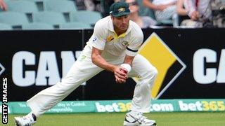 Ryan Harris catches Alastair Cook