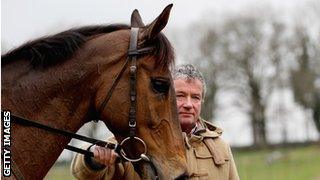 Nigel Twiston-Davies with one of the horses he trains