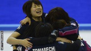 Japan's women curlers celebrate their qualification for Sochi