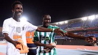 Kouko Guehi and Vivien Mabide of Casablanca celebrate with the boots of Ronaldinho