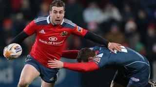 Munster fly-half JJ Hanrahan tries to get past Adam Warren at Musgrave Park