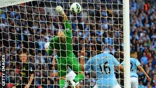 Ben Watson heads past Joe Hart in the FA Cup final