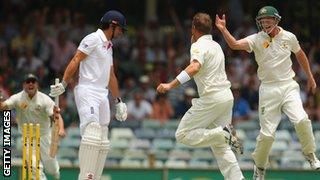 Alastair Cook of England looks dejected after being bowled by Ryan Harris of Australia during day four of the Third Ashes Test Match between Australia and England.