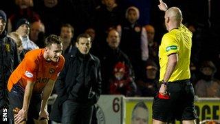 Referee Bobby Madden gives United's Keith Watson his marching orders