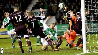 James Collins scores for Hibernian against Hearts