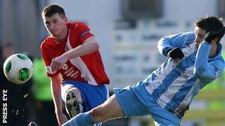 Billy Joe Burns and Stephen McCabe in action at Milltown