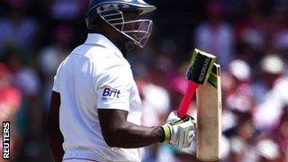 Michael Carberry examines his broken bat at the SCG