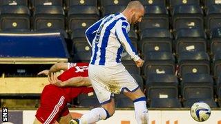 Russell Anderson is challenged by Kris Boyd