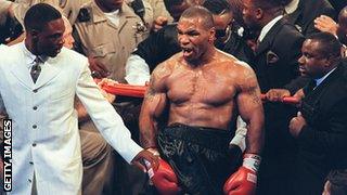 Mike Tyson reacts after being disqualified at the end of the third round of his fight with WBA heavyweight champion Evander Holyfield in the MGM Grand Garden Arena 28 June 1997.