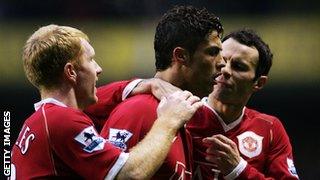 Ronaldo celebrates with Ryan Giggs (right) and Paul Scholes (left).