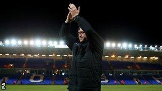 Andy Thorn applauds the Harriers fans at London Road