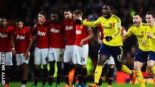 Jozy Altidore, Phil Bardsley and Adam Johnson of Sunderland celebrate following their team's 2-1 victory in the penalty shootout during the Capital One Cup.