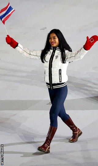 Skier Vanessa-Mae of Thailand waves to the crowd during the opening ceremony