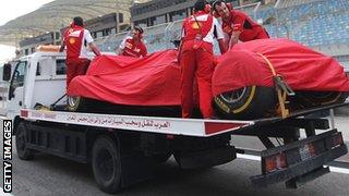 Kimi Raikkonen's car is towed away