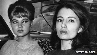 Mandy Rice-Davies (left) who rose to fame for her part in the "Profumo Affair" sits in a car with Christine Keeler (right)