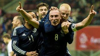 Scotland captain Scott Brown is congratulated following his winner against Poland