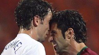 Netherlands's Mark van Bommel and Portugal's Luis Figo clash during the 2006 World cup