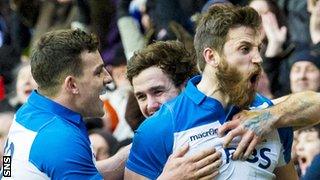 Tommy Seymour (right) celebrates his try against France