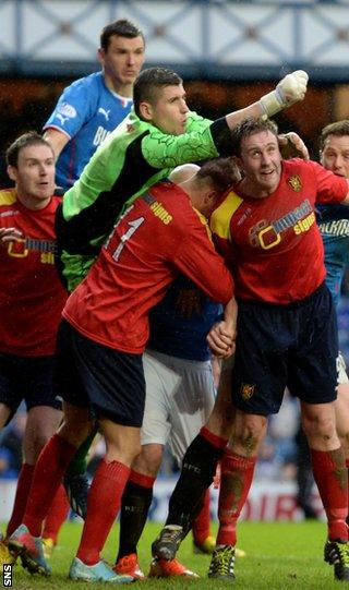 Albion Rovers goalkeeper Neil Parry punches clear