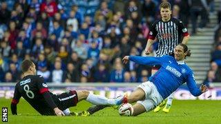 Dunfermline's Stephen Husband and Rangers' Bilel Mohsni battle for the ball