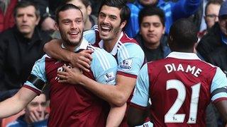 Andy Carroll celebrates his opener at Stoke