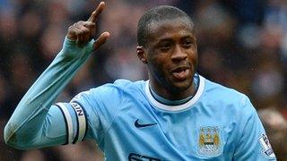 Manchester City midfielder Yaya Toure celebrates scoring against Fulham