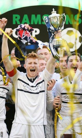 Raith Rovers captain Jason Thomson lifts the Ramsdens Cup