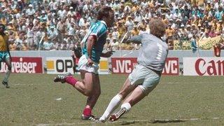 France's Bruno Bellone is fouled by Brazil's Carlos