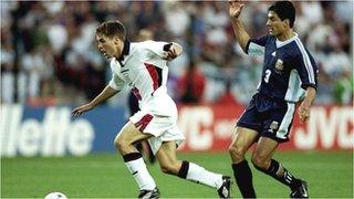 England's Michael Owen goes past Argentina's Jose Chamot to score