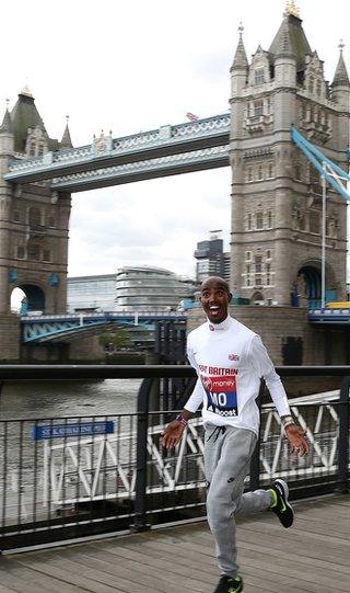 Mo Farah runs past Tower Bridge in London as he prepares to race in the London Marathon