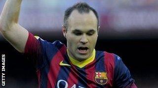 Andres Iniesta celebrates scoring against Osasuna