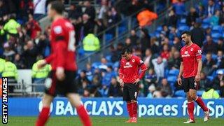 Cardiff players are dejected after the defeat to Crystal Palace