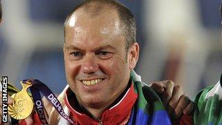 Robert Weale holding his medal