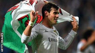 Gareth Bale with a Wales flag