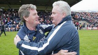 Cavan manager Terry Hyland and Armagh boss Paul Grimley embrace after Cavan's win last year