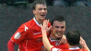 Centre-half partnership Paul Downing and Andy Butler celebrate a goal at Deepdale