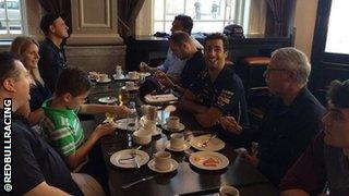 Red Bull driver Daniel Ricciardo enjoys breakfast at the team hotel in Montreal with a few fans.