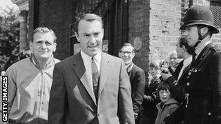 Jimmy Greaves, dressed in suit and tie, walks to Wembley to attend the 1966 World Cup final