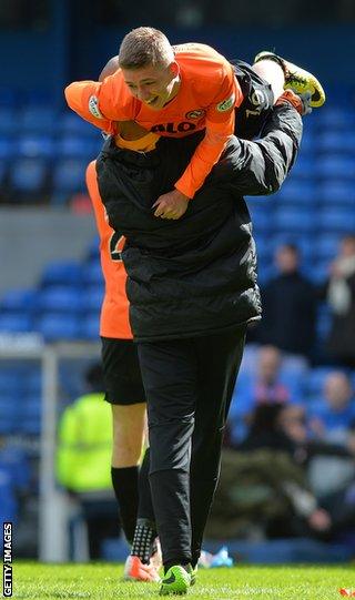 Gauld is carried off the pitch following United's Scottish Cup semi-final win over Rangers