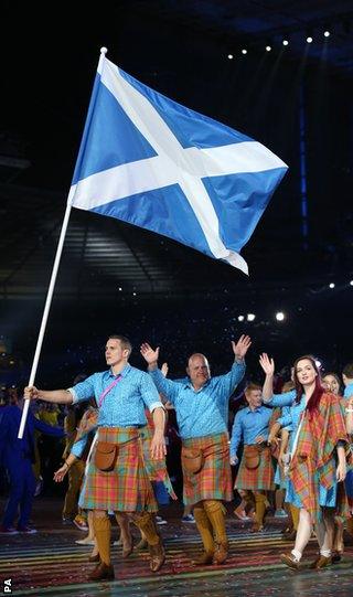 Scotland's Euan Burton carries the flag during the 2014 Commonwealth Games Opening Ceremony at Celtic Par