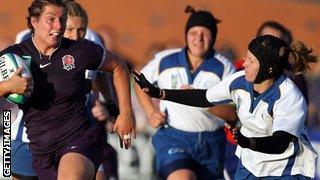 Kazakhstan's Irina Adler (right) tries to make a tackle against England in the 2010 World Cup