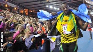 Usain Bolt celebrates at the Commonwealth Games