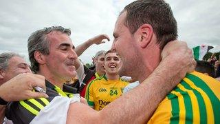 Donegal manager Jim McGuinness embraces his captain Michael Murphy after Ulster title triumph