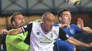 Inverness goalie Dean Brill and David Raven are put under pressure by Rangers striker Nicky Clark