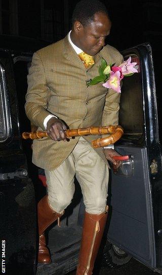 Chris Eubank Sr in riding boots with cane