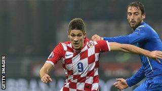 Andrej Kramaric holds off Claudio Marchisio