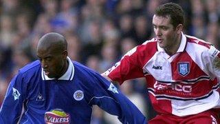 Dean Sturridge of Leicester holds off Paul McCarthy of Wycombe in the quarter-final